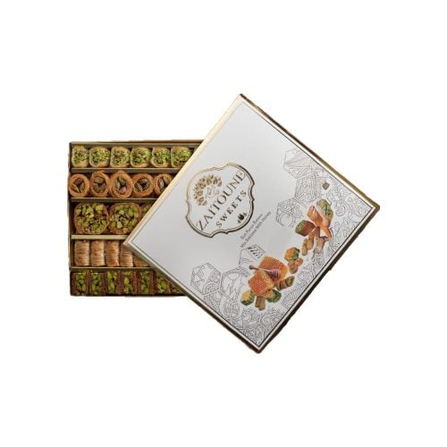 Assorted baklava with honey in box zaitoune